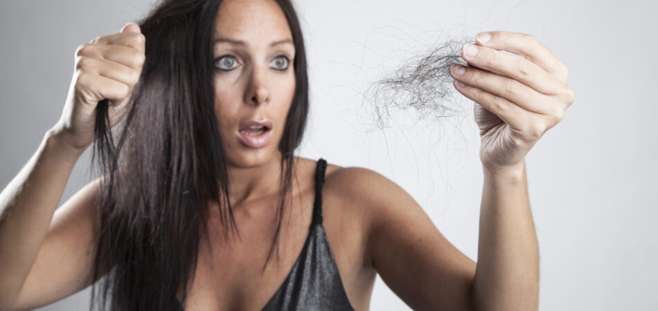 Beautiful,woman,is,very,unhappy,with,her,hair,loss